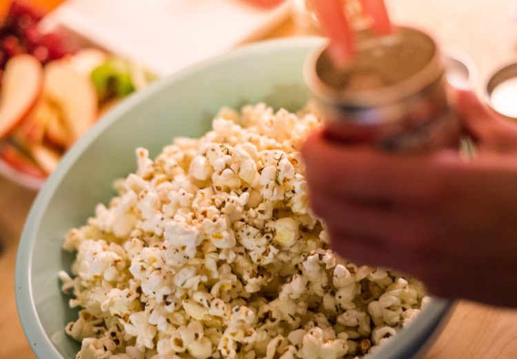 Sprinkling salt on popcorn