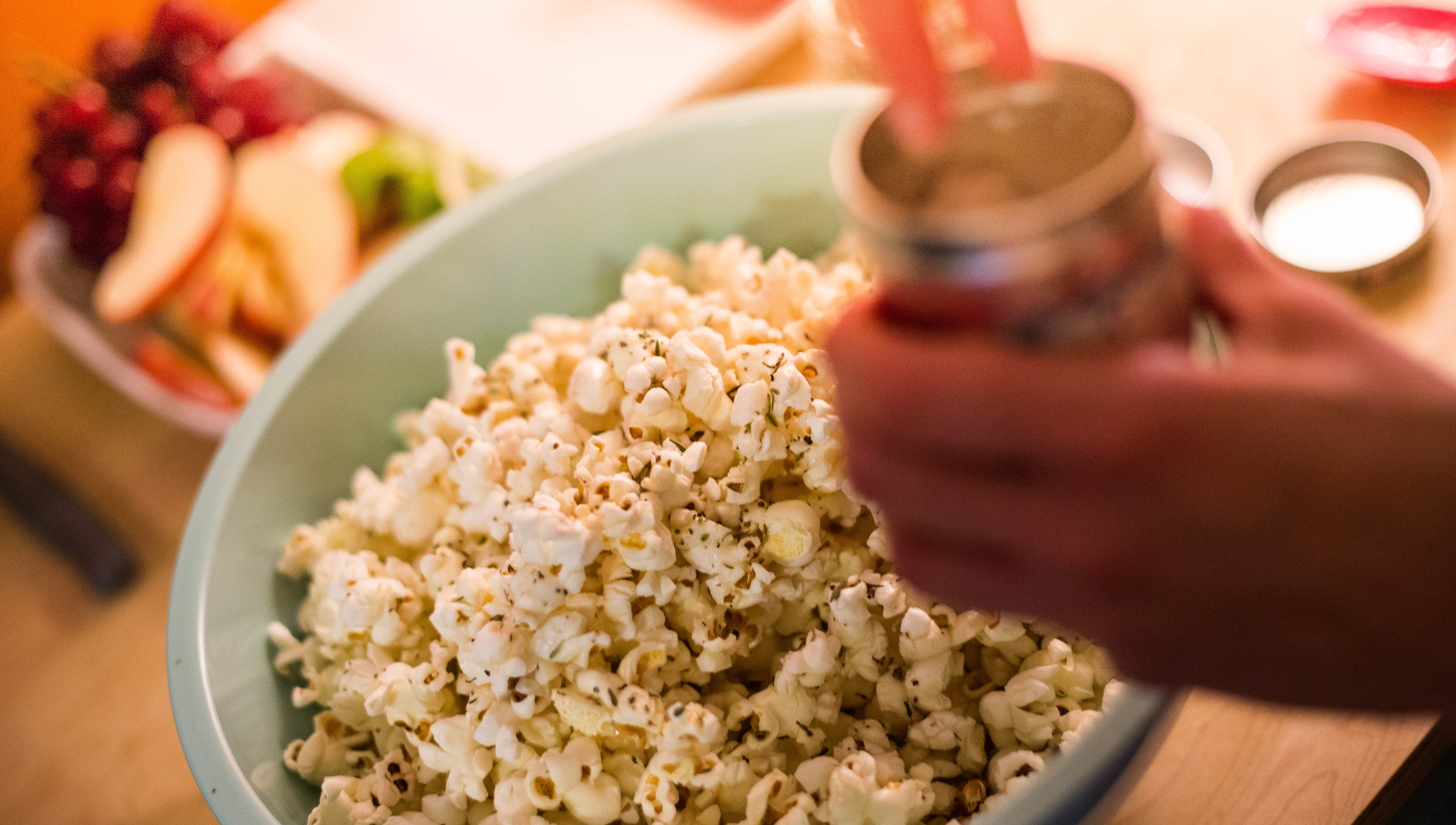 Sprinkling salt on popcorn